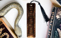 a snake, books, and a bookmark on a table