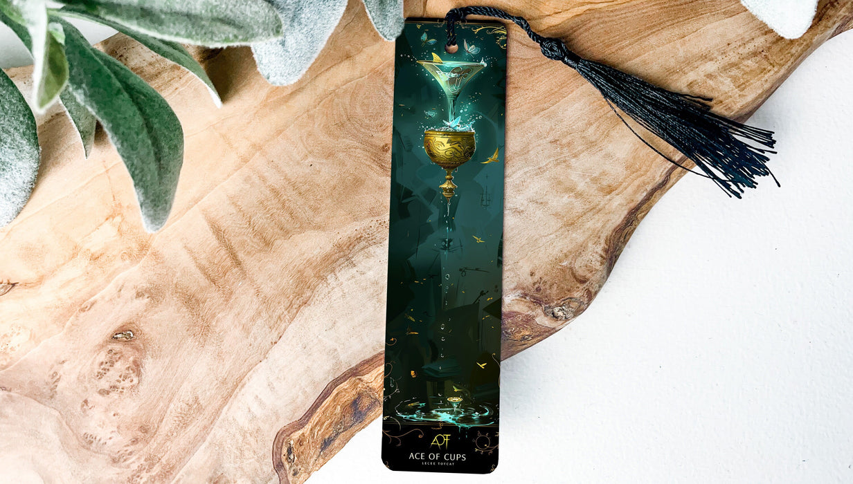 a cross with a tassel hanging from it