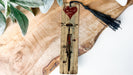 a wooden clock with a red heart on it