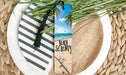 a bookmark with a picture of a beach scene on it