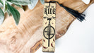 a wooden sign with a bike on it