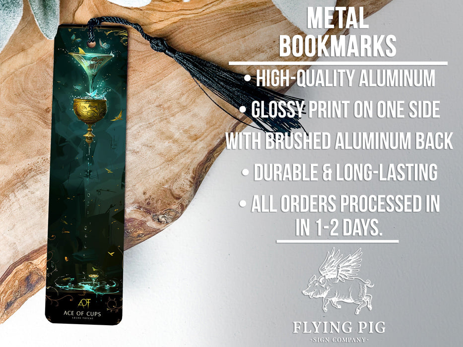 a metal bookmark with a glass of wine on it