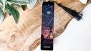 a bookmark with a picture of a telescope on it