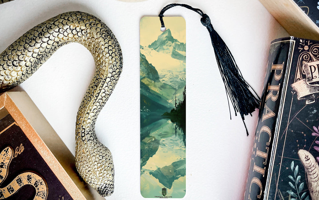 a bookmark with a snake on it next to books