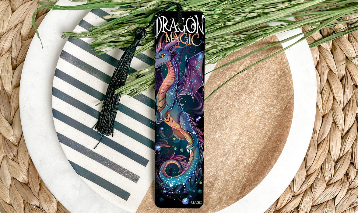a bookmark with a dragon design on it sitting on a plate