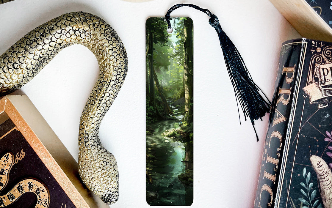 a bookmark with a snake and a book on it