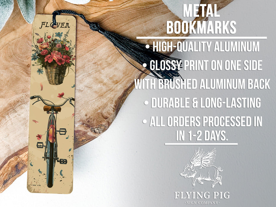 a bookmark with a picture of a bicycle and flowers