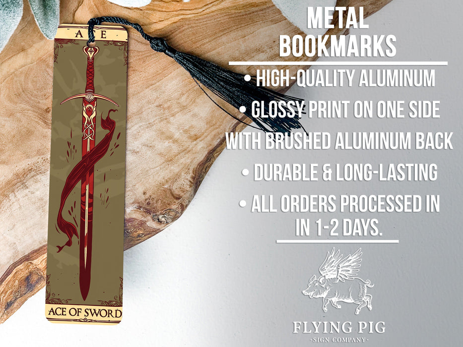 a metal bookmark with a red lizard on it