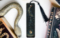 a bookmark, snake, and other items on a table