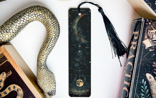 a bookmark, snake, and other items on a table