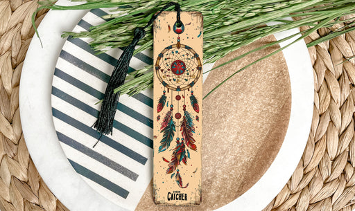 a wooden bookmark with a tassel on top of a plate