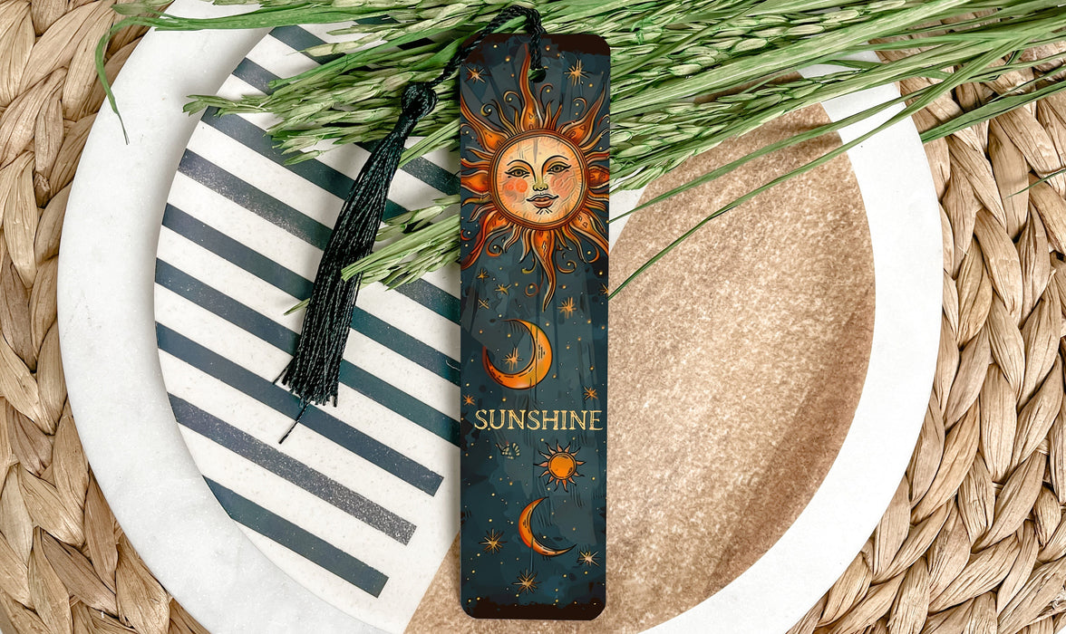 a sun and moon bookmark on a plate