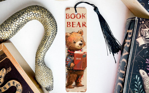 a bookmark with a picture of a bear and a snake