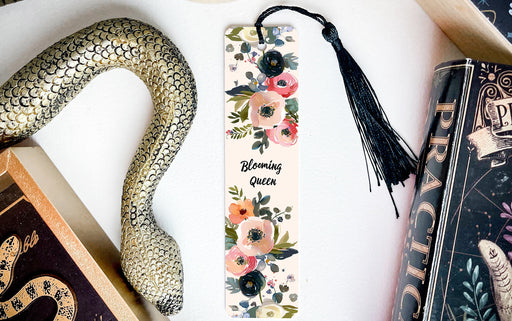 a bookmark with a snake and flowers on it
