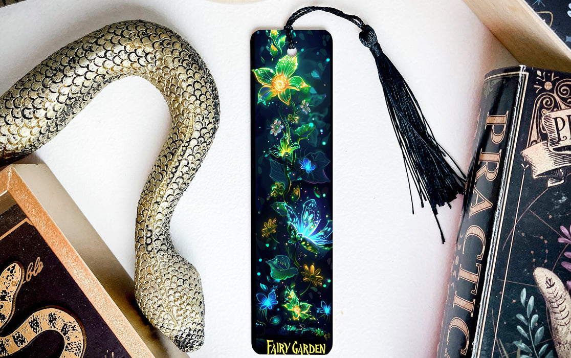 a bookmark with a snake and flowers on it