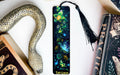 a bookmark with a snake and flowers on it