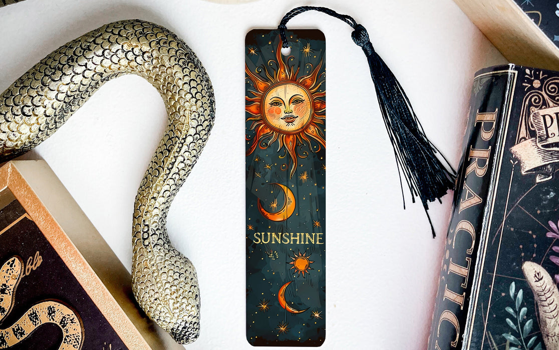 a bookmark with a sun and moon on it