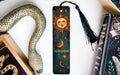 a bookmark with a sun and moon on it