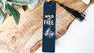 a bookmark with the words wild and free on it