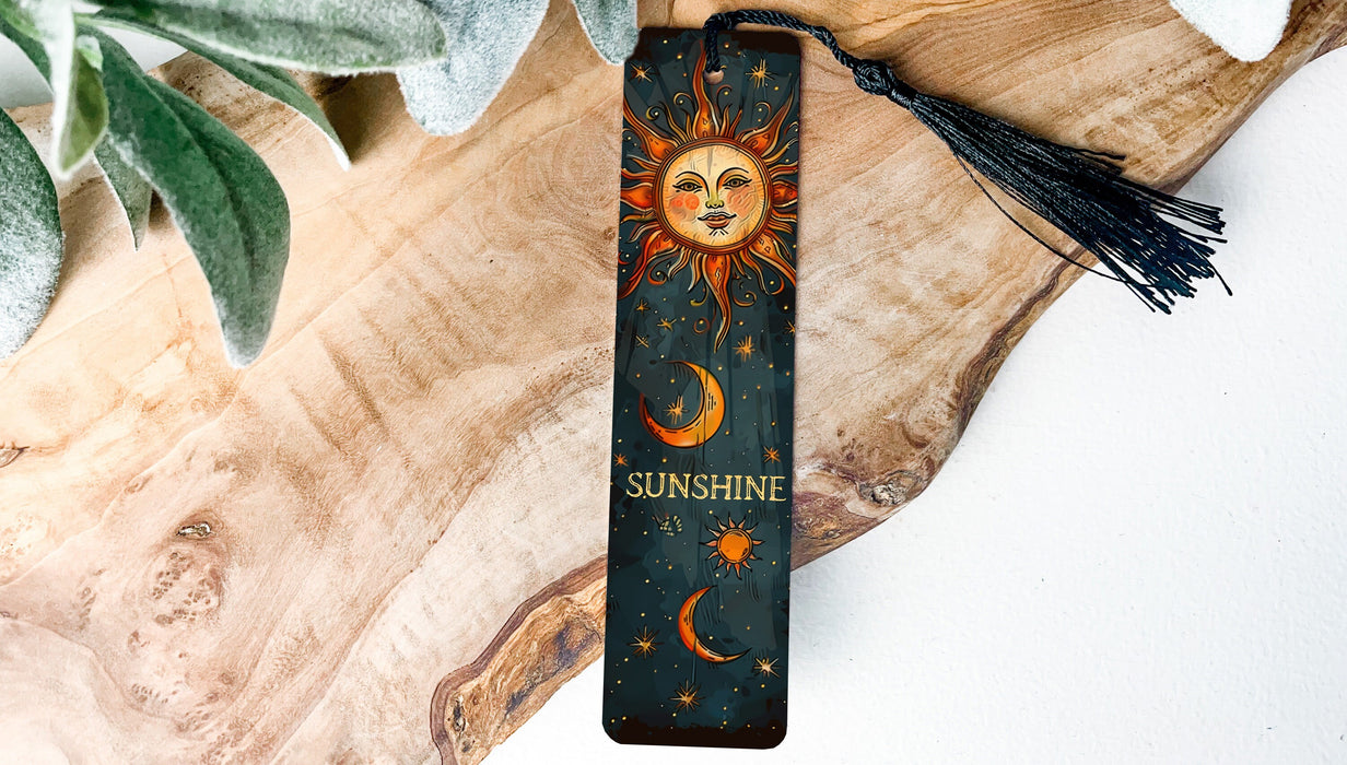 a bookmark with a sun and moon on it
