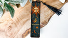 a bookmark with a sun and moon on it