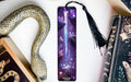 a bookmark with an image of a dragon and a snake on it