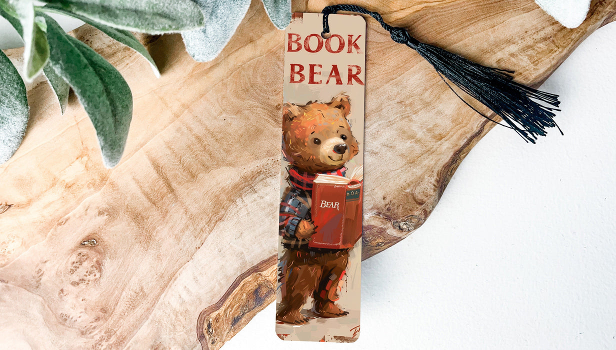a bookmark with a picture of a bear holding a book