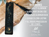 a metal bookmark with a black tassel on it