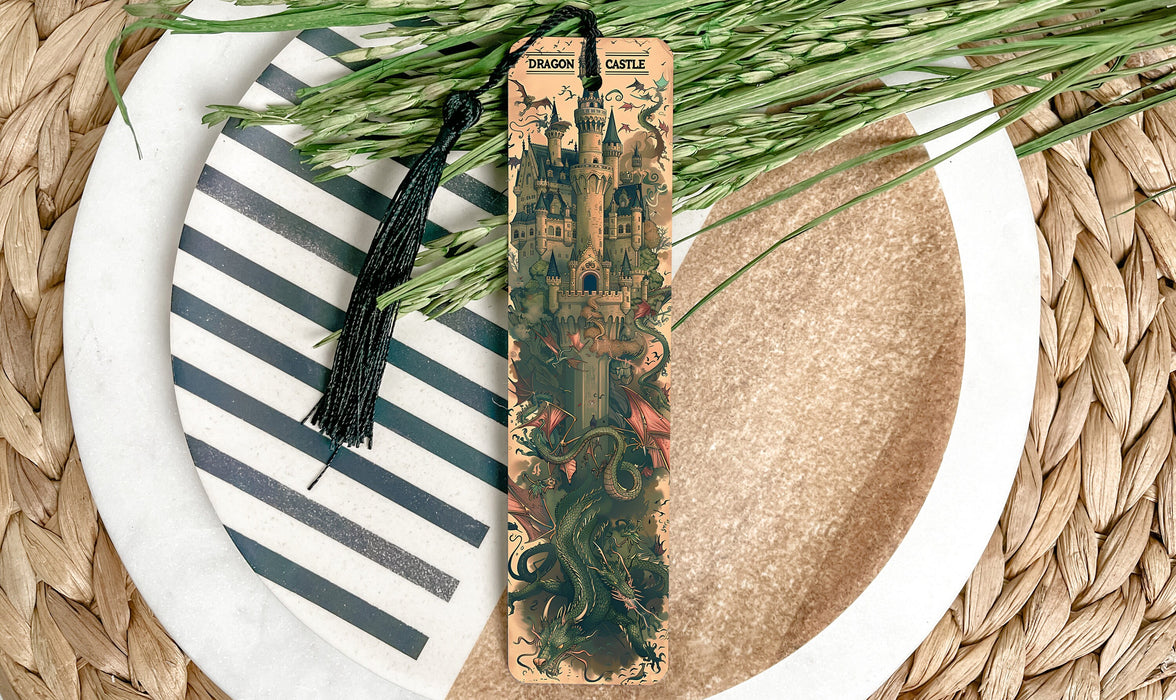 a plate with a bookmark and some green plants on it
