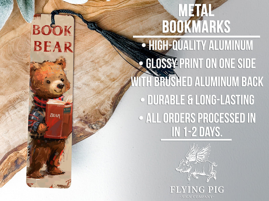 a bookmark with a picture of a bear holding a book