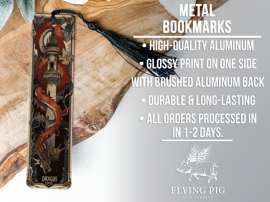 a metal bookmark with a red dragon on it