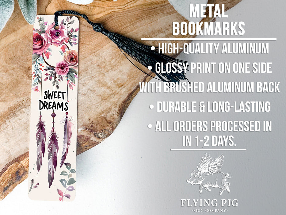 a bookmark with flowers and feathers on it