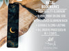 a metal bookmark with a crescent moon on it