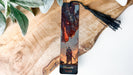 a bookmark with a picture of a dragon on it