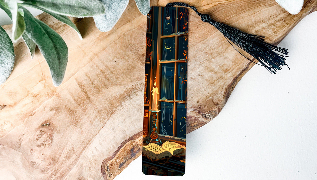 a wooden piece of art with a tassel hanging from it