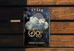 a steam clock with gears on it on a wooden bench