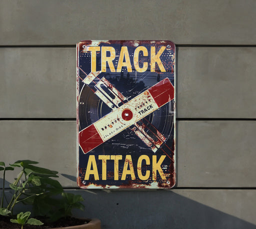 a sign on a wall that says track attack
