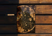a wooden bench with a map on it