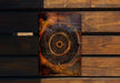 a wooden wall with a metal object on it