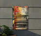 a painting on a wall next to a potted plant