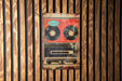 a picture of a radio on a wooden wall