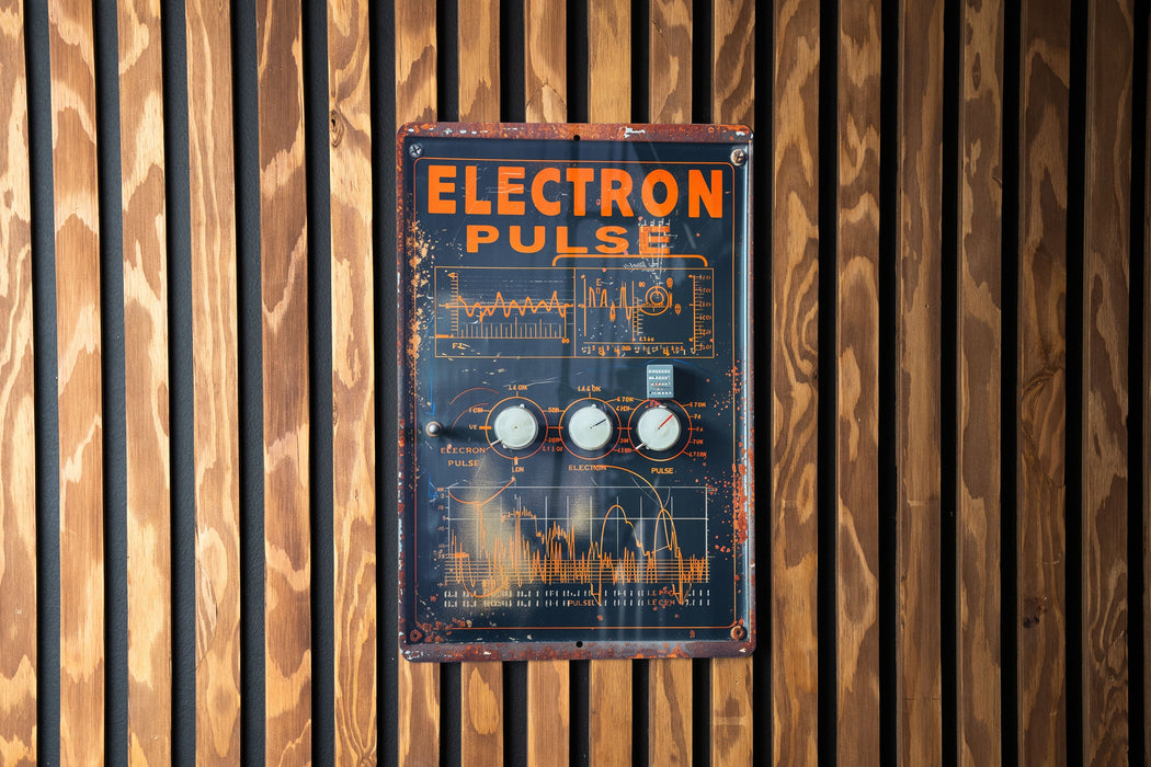 a close up of a sign on a wooden wall
