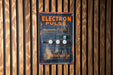 a close up of a sign on a wooden wall