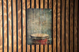 a picture of a drum on a wooden wall