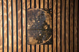 a wooden wall with a clock on it