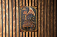 a wooden wall with a painting of a brush and flowers on it