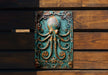 an octopus sculpture on a wooden wall