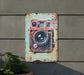 a picture of a camera hanging on a wall