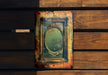 a picture of a mirror on a wooden wall
