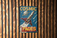 a sign on a wooden wall that says cosmic pages